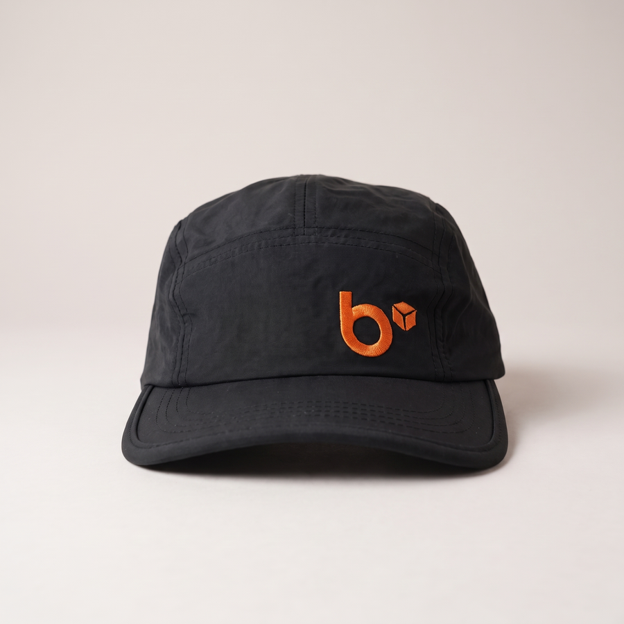 b.cubed 5 Panel Work Cap in black with embroidered orange logo