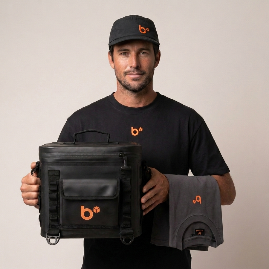 Tradie wearing the b.cubed work cap and black work tee, holding THE CUBE lunchbox and the grey work tee